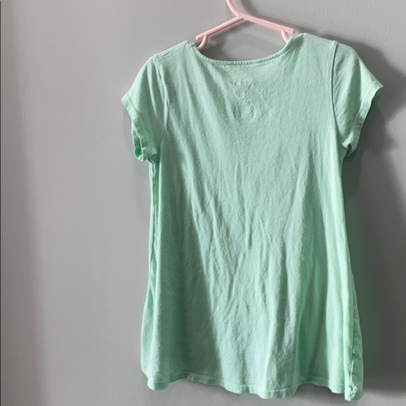 It is a Tinker Bell shirt on Disney - Picture 3 of 5